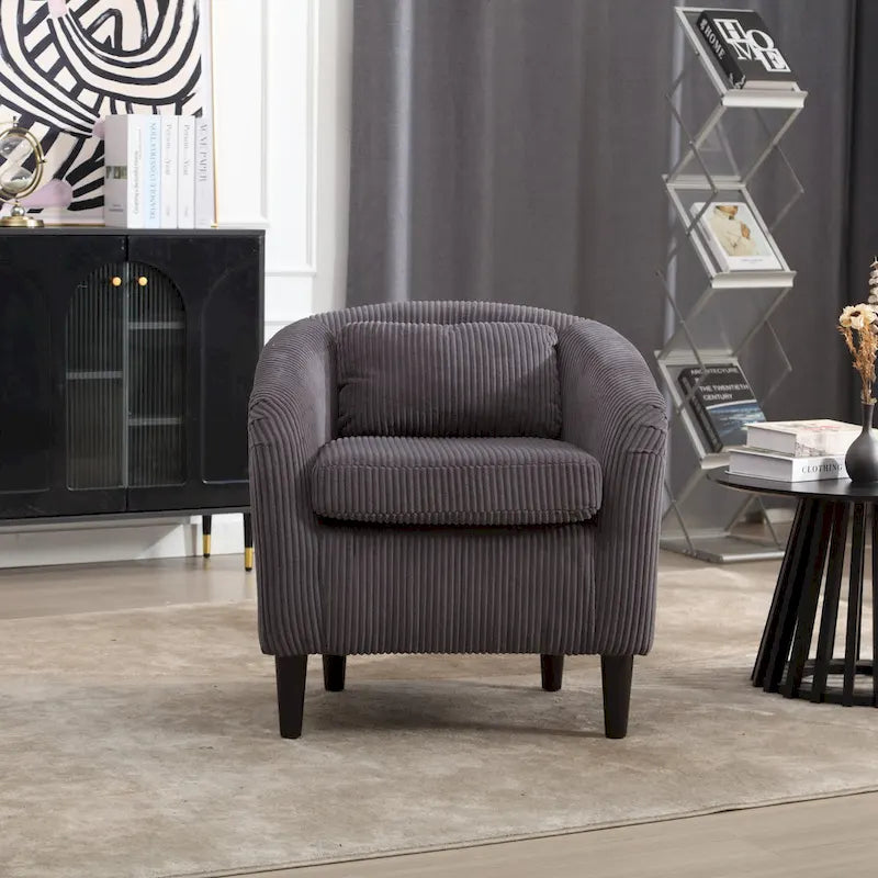 Stoffen fauteuil met kussen en en sierkussen