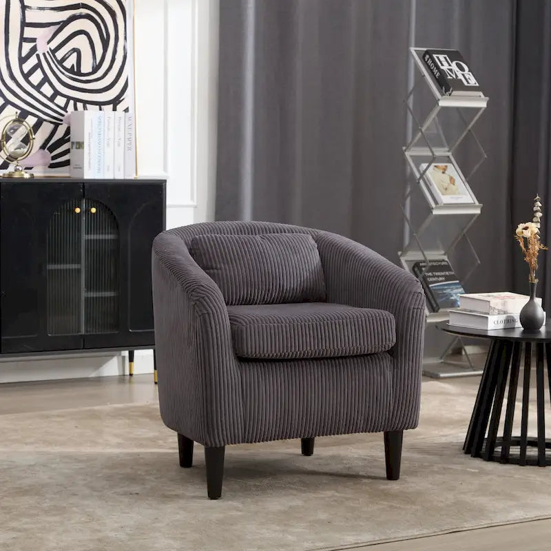 Stoffen fauteuil met kussen en en sierkussen