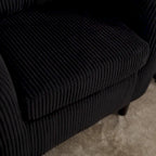 Stoffen fauteuil met kussen en en sierkussen
